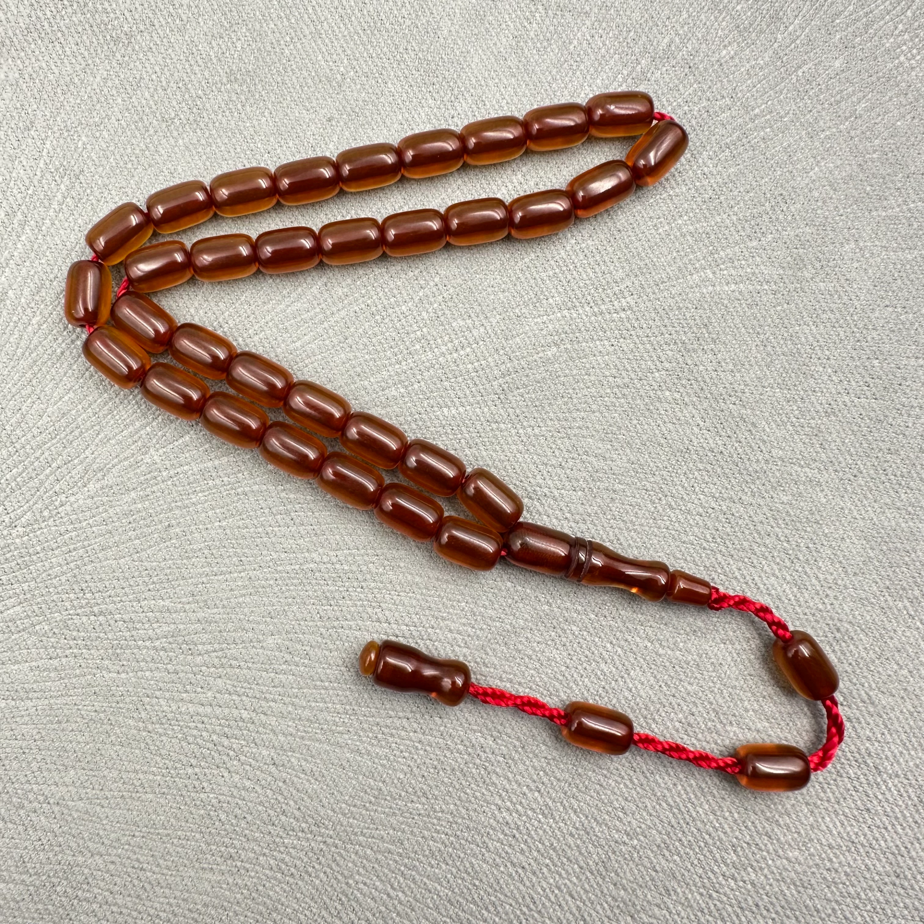 Koyu Amber Tonlu Parlak Kapsül Kesim Sıkma Kehribar Tespih